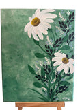 White daisies against a textured green background